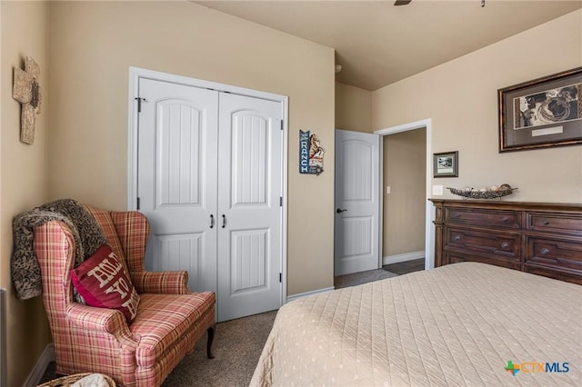 bedroom with carpet flooring, baseboards, a closet, and ceiling fan