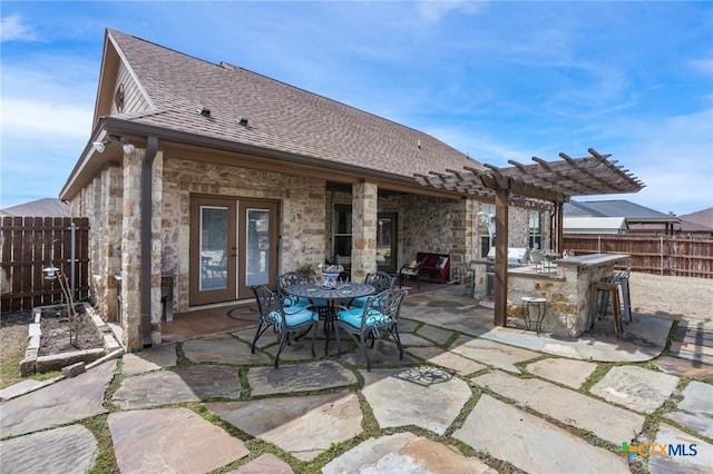 view of patio with fence, french doors, a pergola, and outdoor dry bar