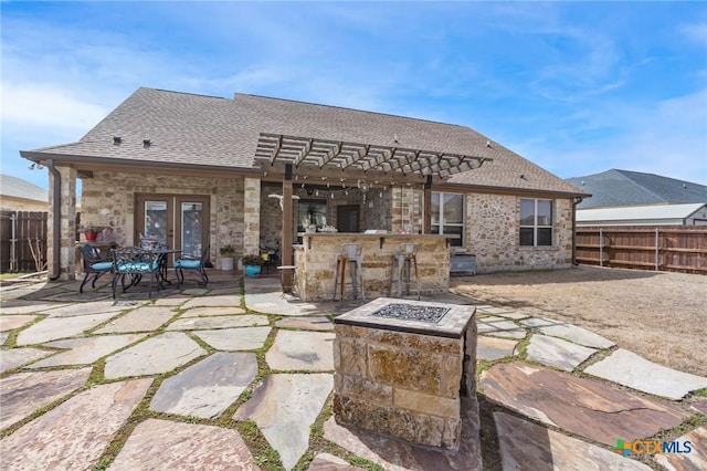 view of patio with a pergola, french doors, fence, and outdoor dry bar