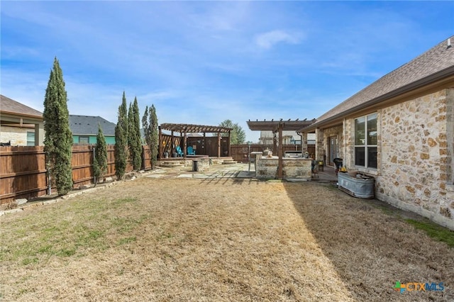 view of yard featuring a patio area, a pergola, and a fenced backyard