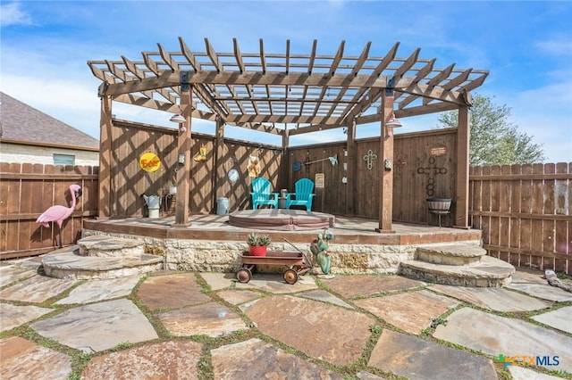 view of patio with a pergola and fence