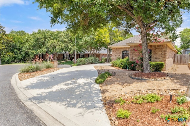 217 Ciela Vis, Seguin, TX 78155 - view of front facade with brick siding and curved driveway