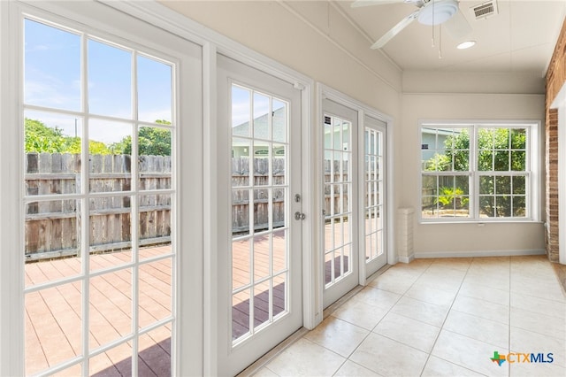 217 Ciela Vis, Seguin, TX 78155 - doorway with a ceiling fan, tile patterned floors, and baseboards
