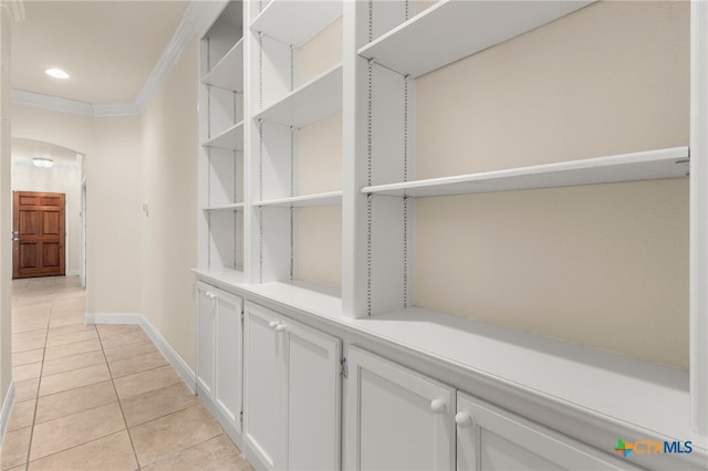 217 Ciela Vis, Seguin, TX 78155 - corridor with light tile patterned floors, ornamental molding, baseboards, recessed lighting, and arched walkways