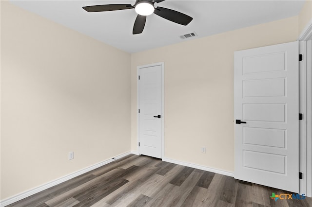 5222 Rose Garden Loop, Killeen, TX 76542 - unfurnished bedroom with dark wood finished floors, baseboards, and a ceiling fan