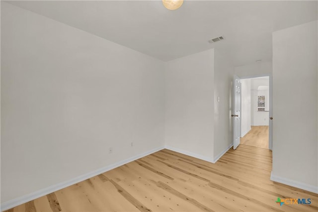 unfurnished room featuring light hardwood / wood-style floors