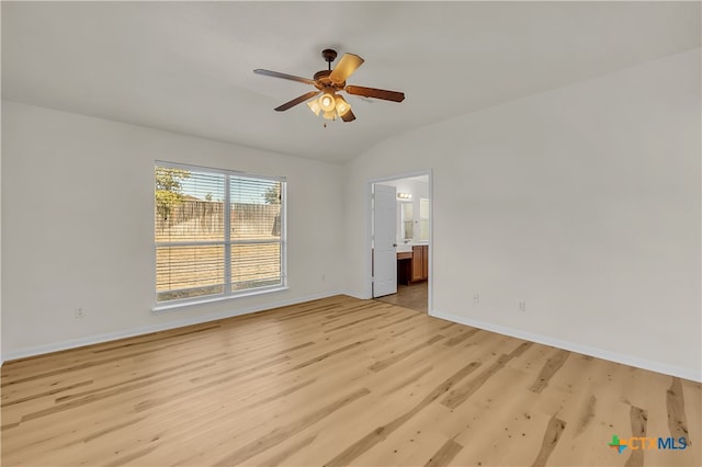 unfurnished room featuring ceiling fan, light hardwood / wood-style floors, and vaulted ceiling