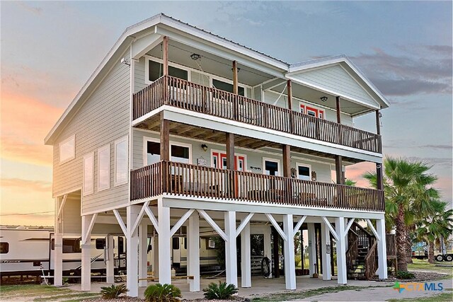 1265 N Ocean Dr, Port Lavaca, TX 77979 - view of front facade with stairs and a balcony