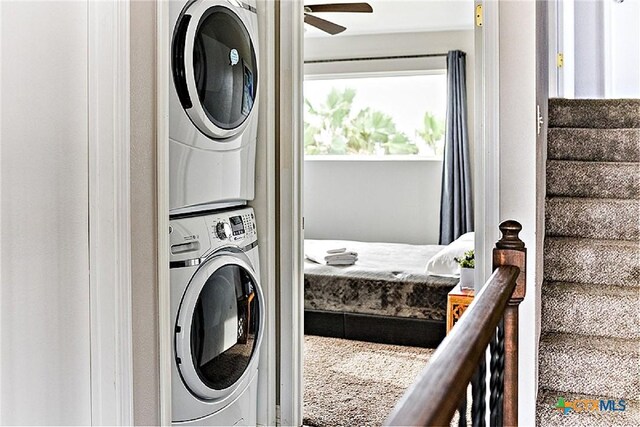 1265 N Ocean Dr, Port Lavaca, TX 77979 - clothes washing area featuring ceiling fan, stacked washer and clothes dryer, and laundry area