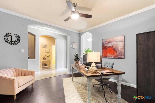 office space featuring ceiling fan, ornamental molding, and hardwood / wood-style flooring