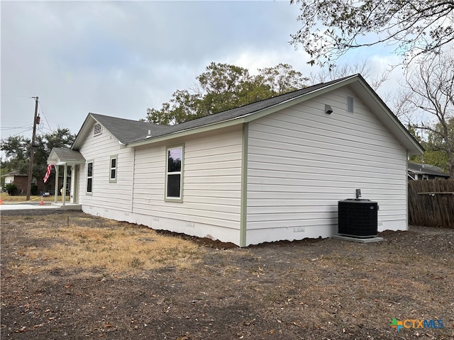 view of side of property featuring central AC unit