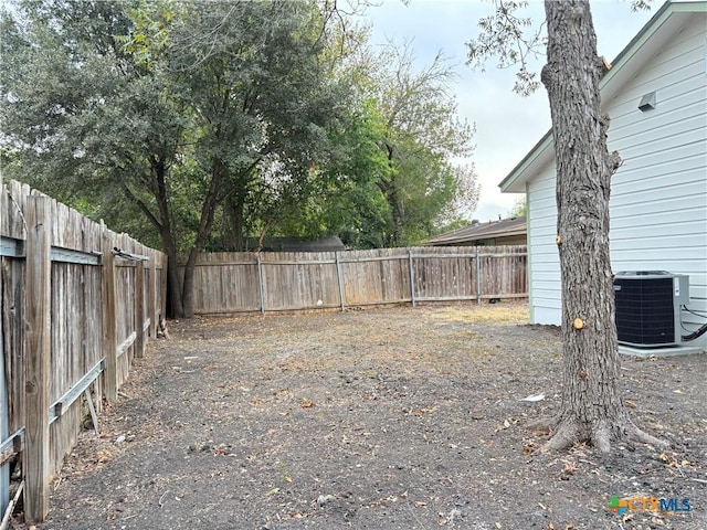 view of yard featuring central AC unit