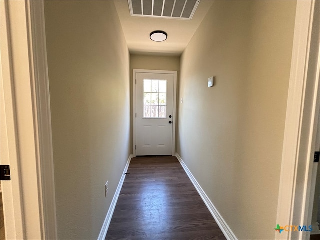 doorway featuring dark hardwood / wood-style floors