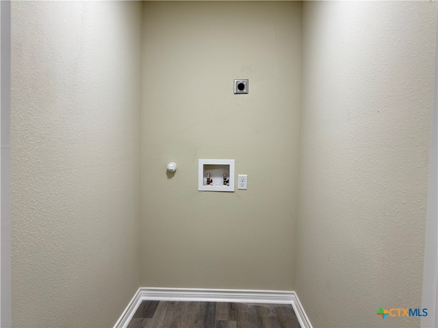 washroom featuring hookup for an electric dryer, washer hookup, hardwood / wood-style flooring, and gas dryer hookup