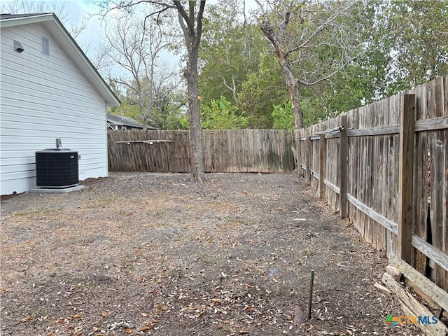 view of yard with central AC