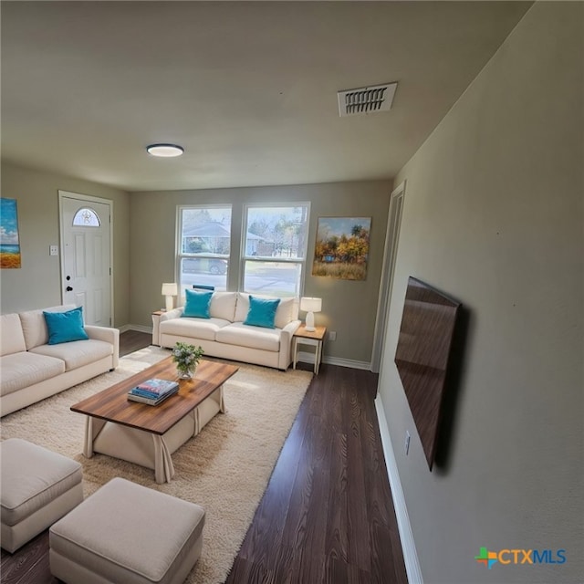 living room with dark wood-type flooring