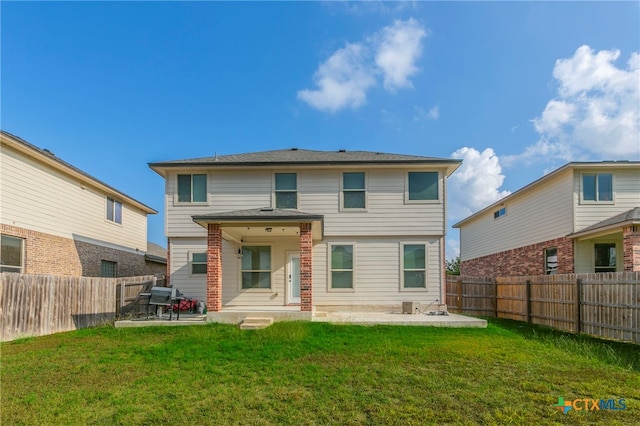 back of property with central AC unit, a yard, and a patio area