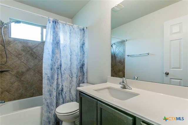 full bathroom with shower / bath combo with shower curtain, vanity, and toilet