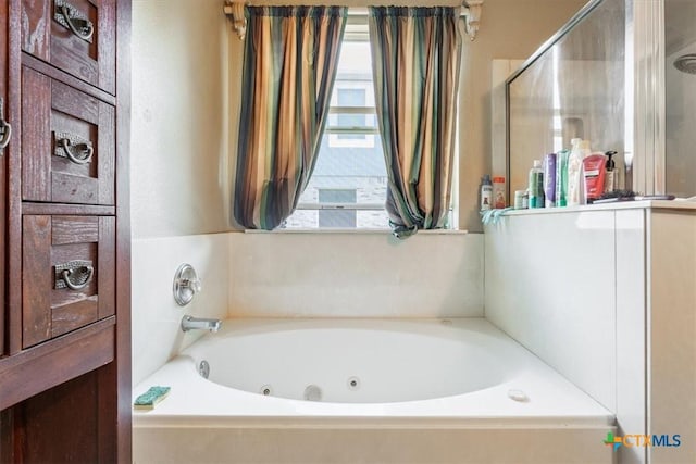 5407 Whistle Stop Dr, Temple, TX 76502 - bathroom with a tub with jets
