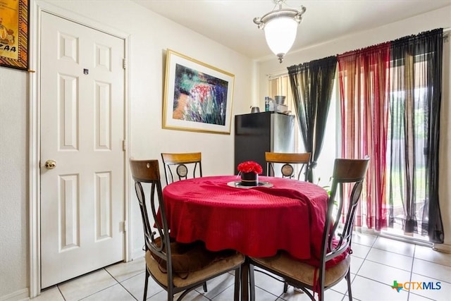5407 Whistle Stop Dr, Temple, TX 76502 - dining space with light tile patterned floors and healthy amount of natural light