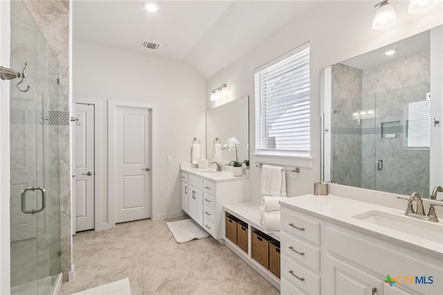 156 High Plains Dr, Georgetown, TX 78628 - full bath with two vanities, a stall shower, and lofted ceiling