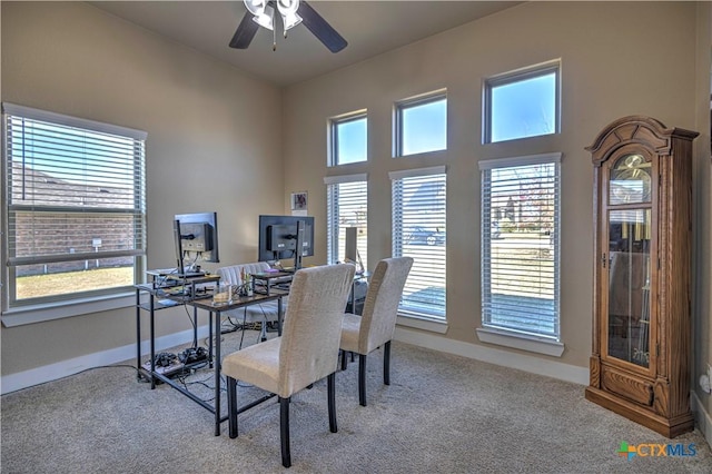 home office with light colored carpet and ceiling fan