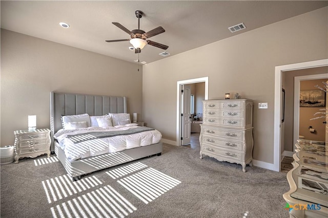 bedroom with carpet flooring, ceiling fan, and connected bathroom