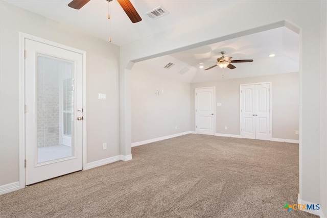 carpeted empty room with lofted ceiling and ceiling fan