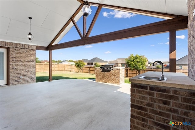 view of patio with sink and exterior kitchen