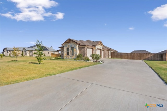 view of front facade with a garage and a front yard