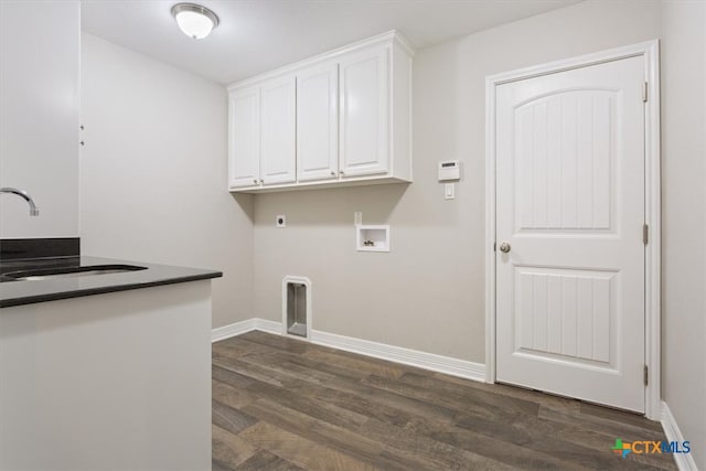 laundry room with cabinets, sink, hookup for an electric dryer, dark wood-type flooring, and hookup for a washing machine