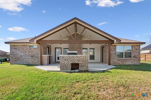 back of house featuring a lawn, a patio, and ceiling fan