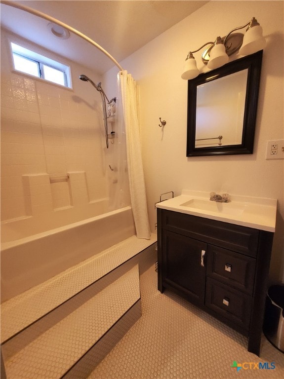 bathroom featuring shower / tub combo and vanity