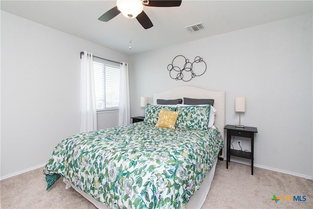 bedroom featuring baseboards, visible vents, ceiling fan, and carpet flooring