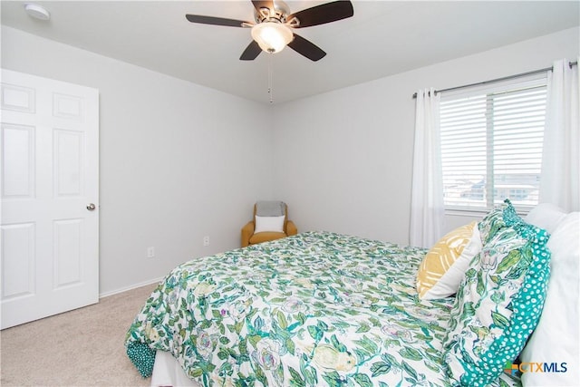 carpeted bedroom featuring a ceiling fan