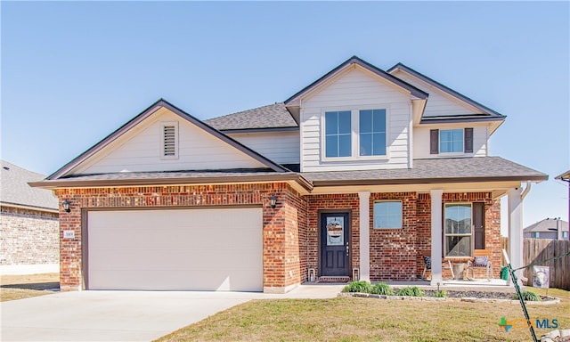 view of front of property featuring covered porch, a garage, brick siding, fence, and driveway