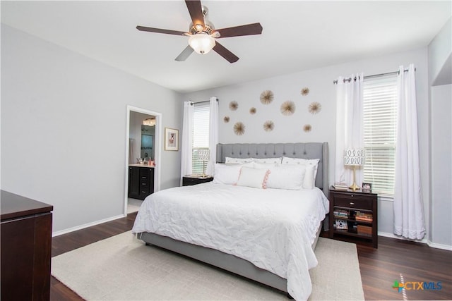 bedroom with ceiling fan, wood finished floors, and baseboards