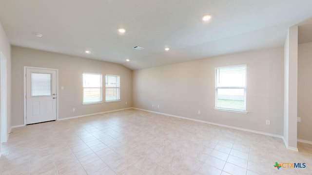 spare room with baseboards, plenty of natural light, visible vents, and recessed lighting