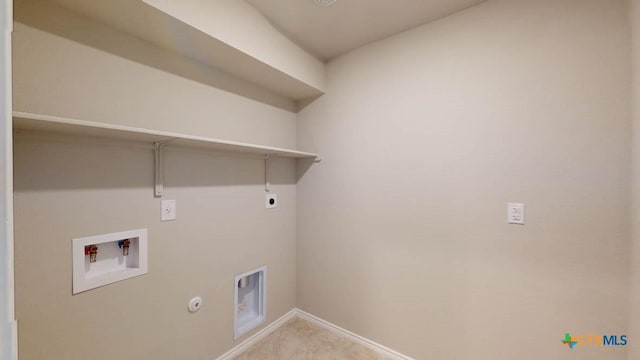 clothes washing area with laundry area, baseboards, gas dryer hookup, hookup for a washing machine, and electric dryer hookup