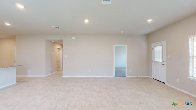 unfurnished room featuring visible vents, baseboards, and recessed lighting