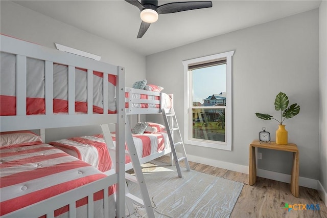 121 Bufflehead Ln, Rockport, TX 78382 - bedroom featuring wood finished floors, baseboards, and a ceiling fan