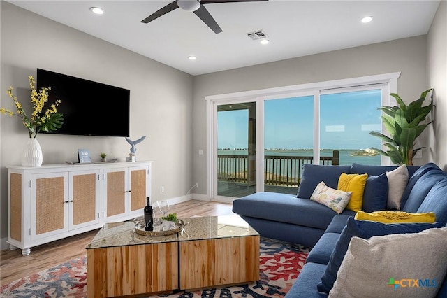 121 Bufflehead Ln, Rockport, TX 78382 - living room featuring a ceiling fan, wood finished floors, baseboards, and recessed lighting
