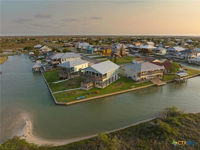 121 Bufflehead Ln, Rockport, TX 78382 - aerial view at dusk of a water view and a residential view