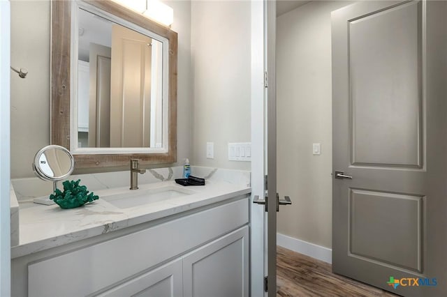 121 Bufflehead Ln, Rockport, TX 78382 - bathroom featuring vanity, wood finished floors, and baseboards