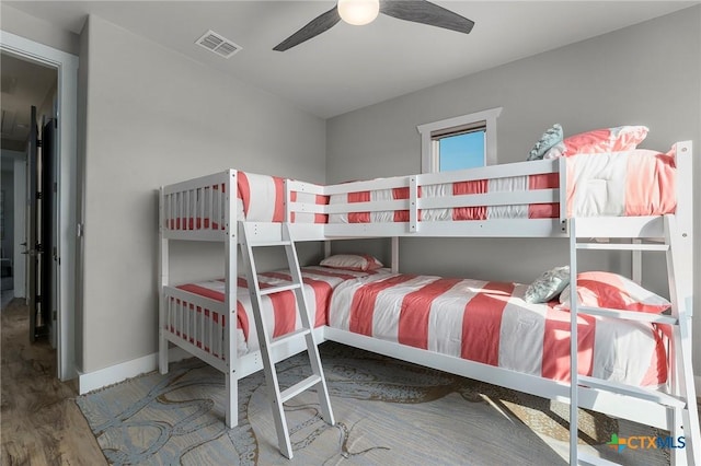 121 Bufflehead Ln, Rockport, TX 78382 - bedroom featuring wood finished floors, baseboards, and ceiling fan