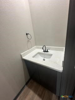 bathroom featuring vanity and wood finished floors