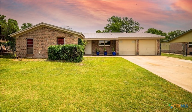 1906 N 60th St, Killeen, TX 76543 - ranch-style house featuring brick siding, a garage, and driveway