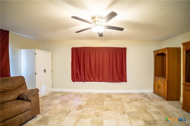 1906 N 60th St, Killeen, TX 76543 - living area with ceiling fan and baseboards