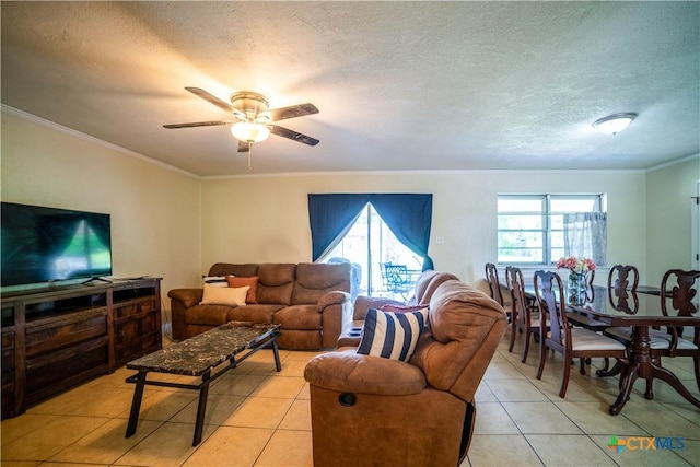 1906 N 60th St, Killeen, TX 76543 - living room with light tile patterned floors, ornamental molding, ceiling fan, and a textured ceiling