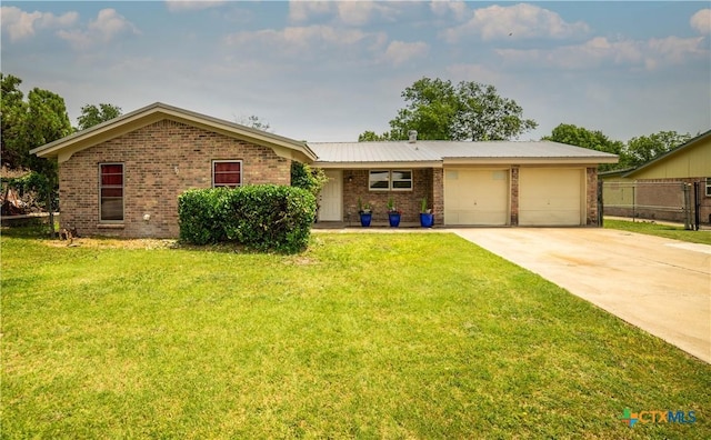 1906 N 60th St, Killeen, TX 76543 - single story home featuring brick siding, a garage, and driveway